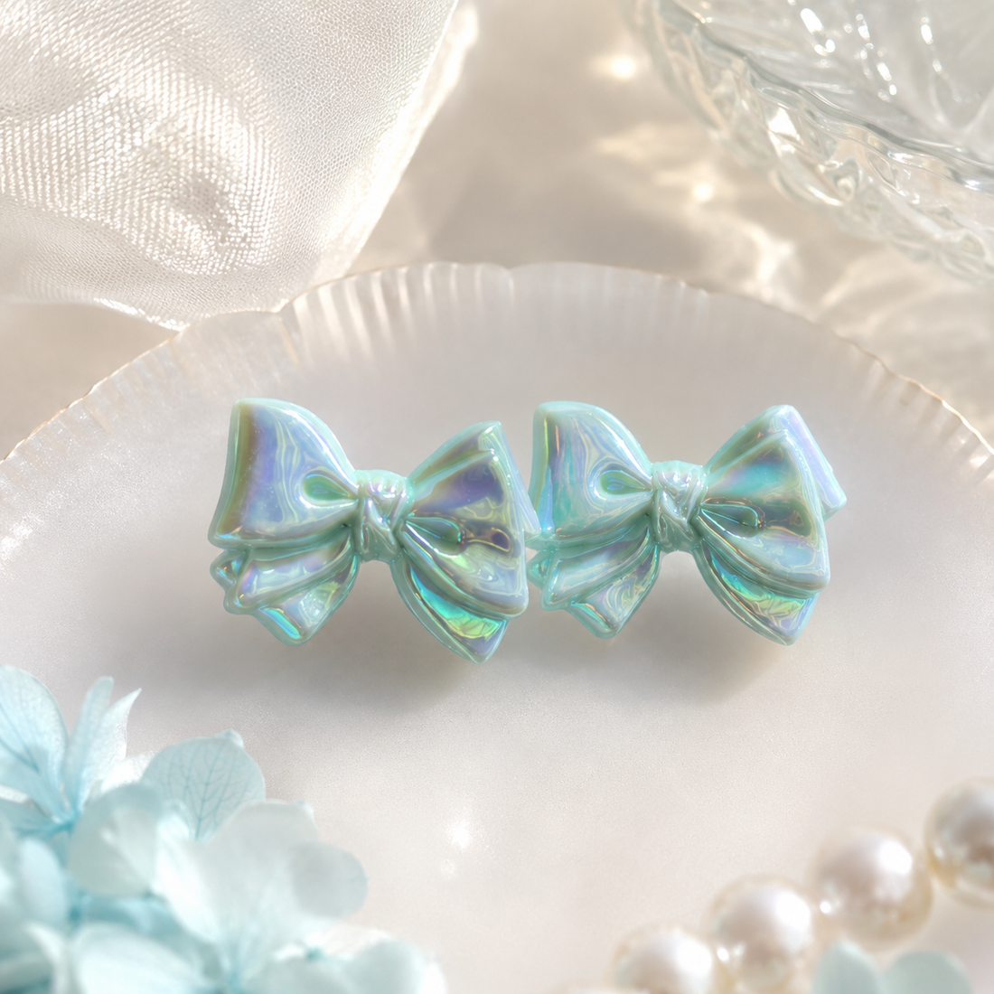 Light Blue Iridescent Acrylic Bow Earrings