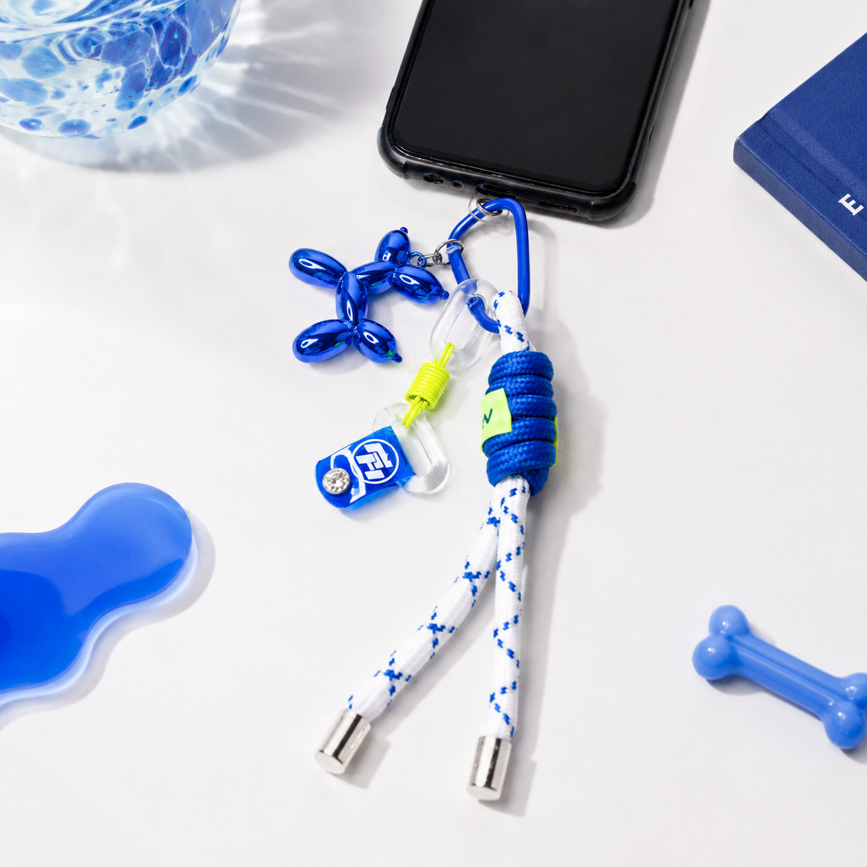 White &amp; Blue Braided Mobile Wrist Strap with Balloon Dog Charm